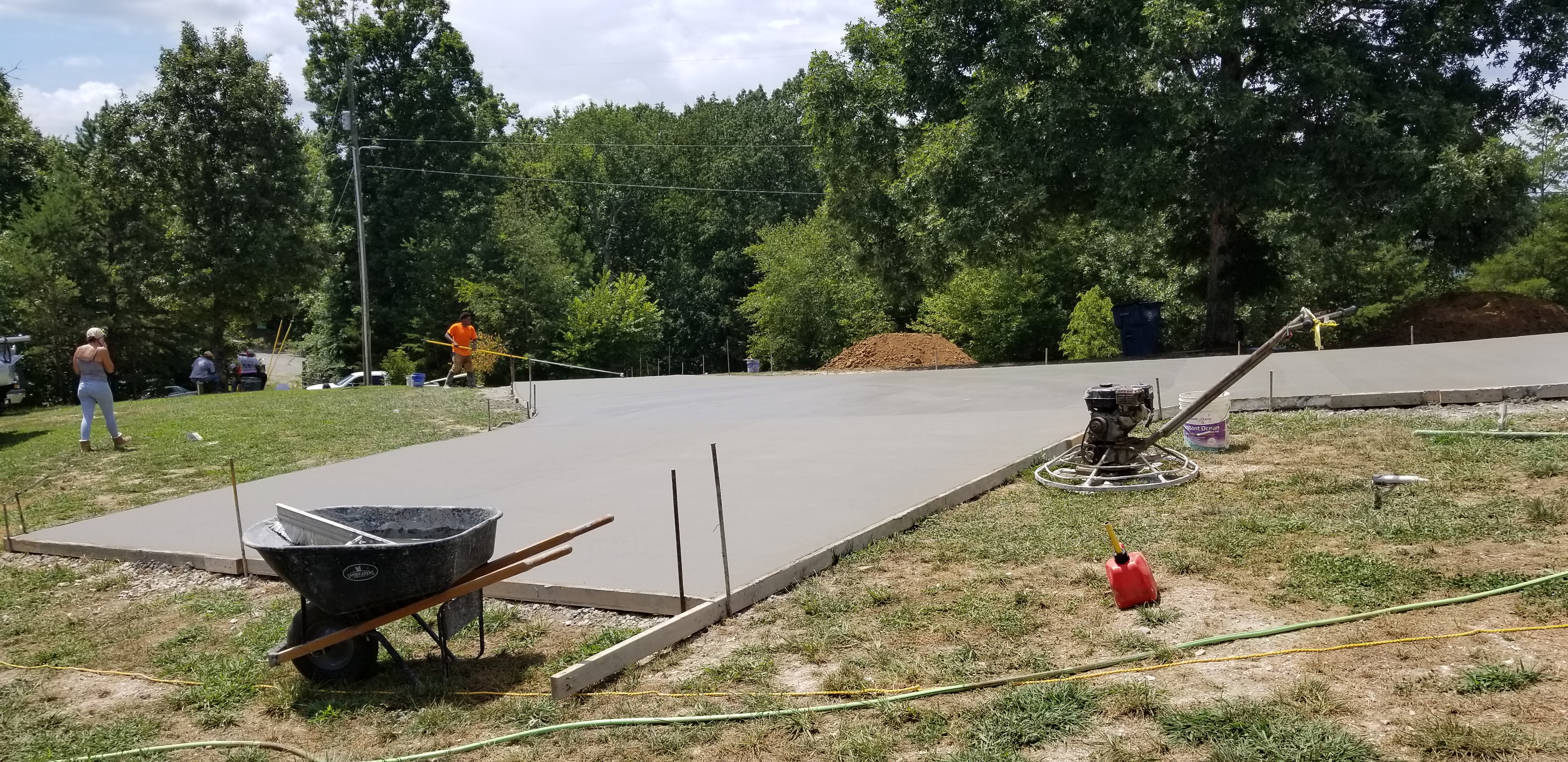 Concrete driveway finishing with equipment