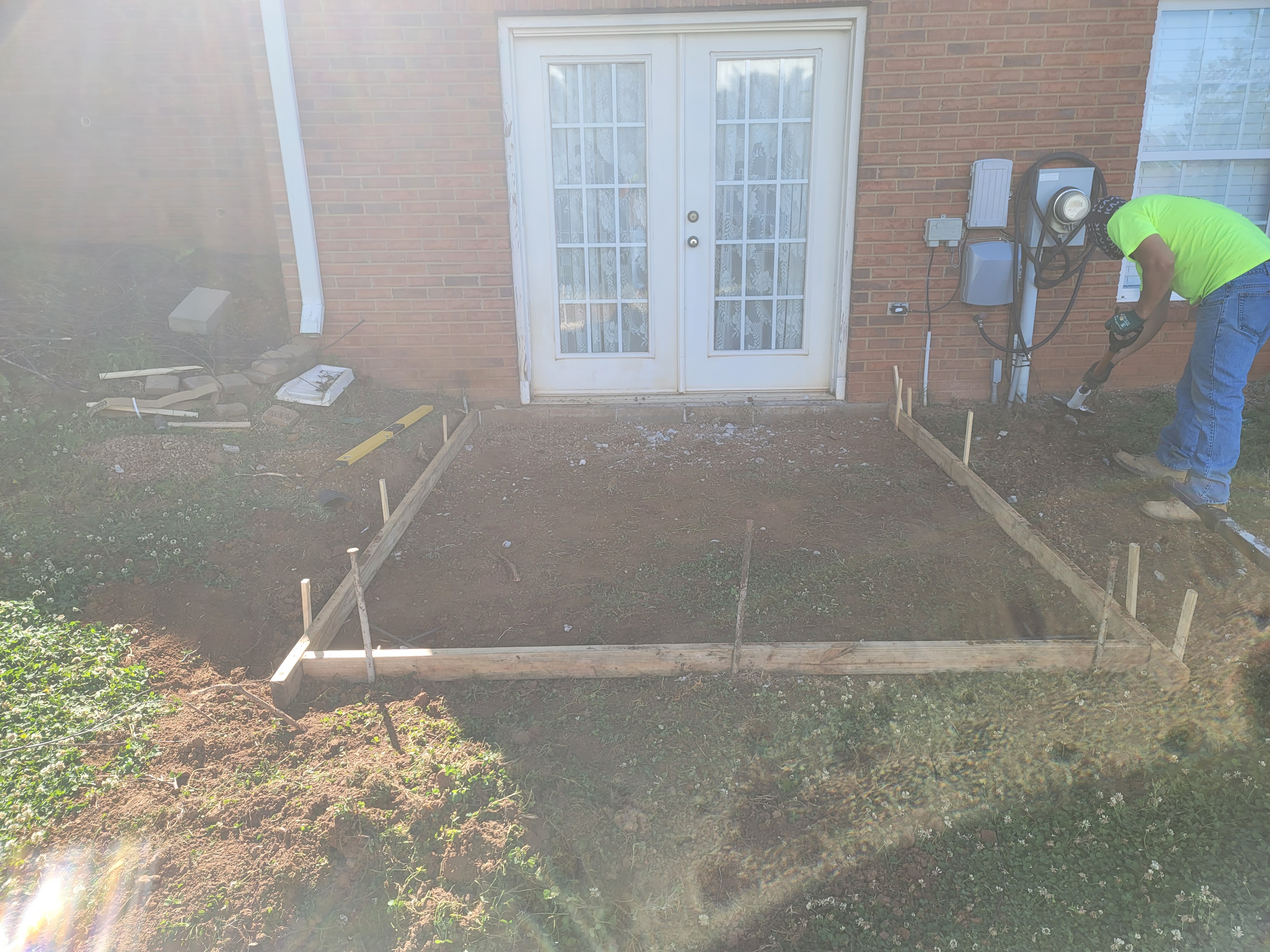 Concrete pad preparation with wood forms