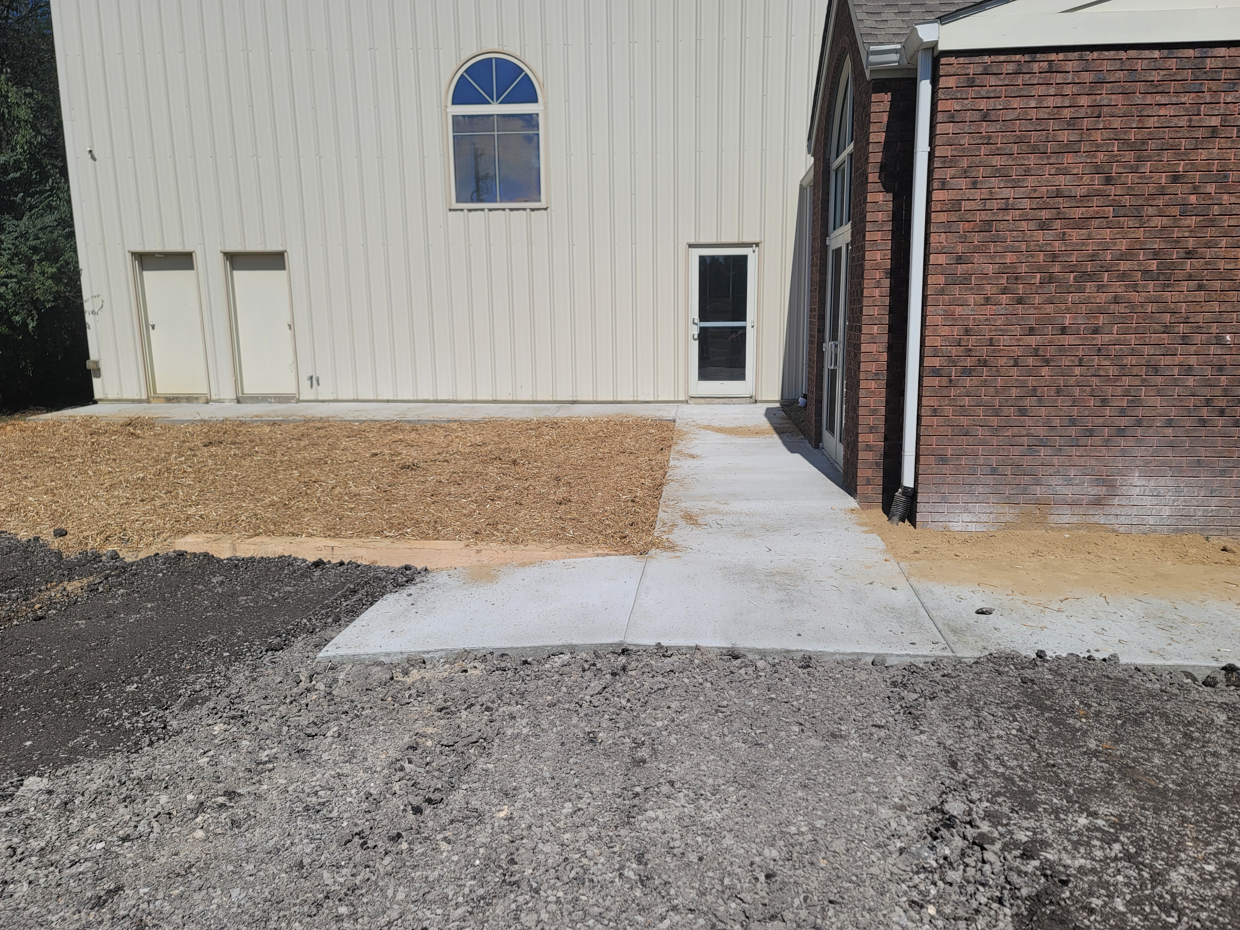 Finished concrete walkway along building exterior