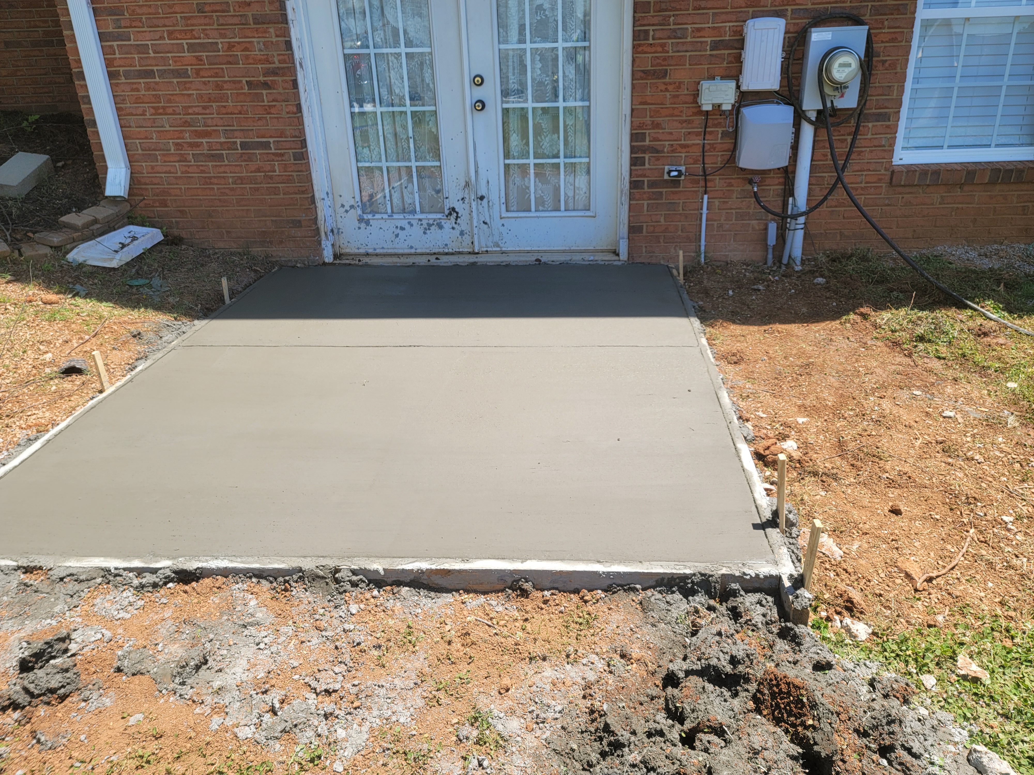 Freshly poured concrete door pad