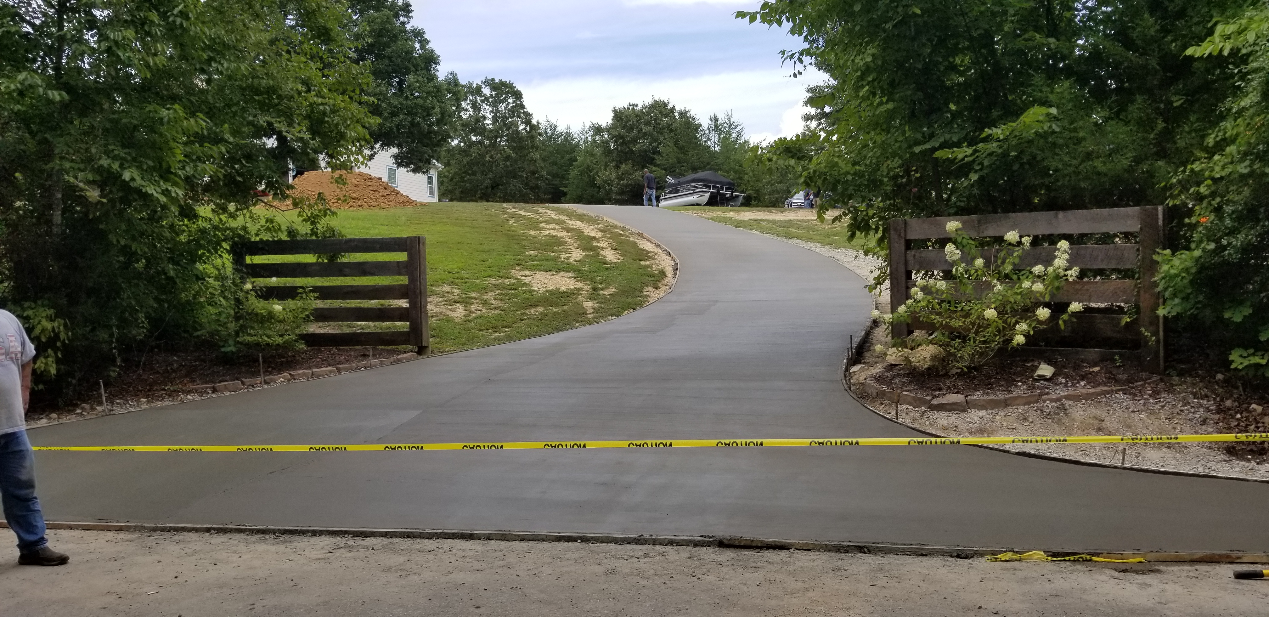 Long curving concrete driveway entrance