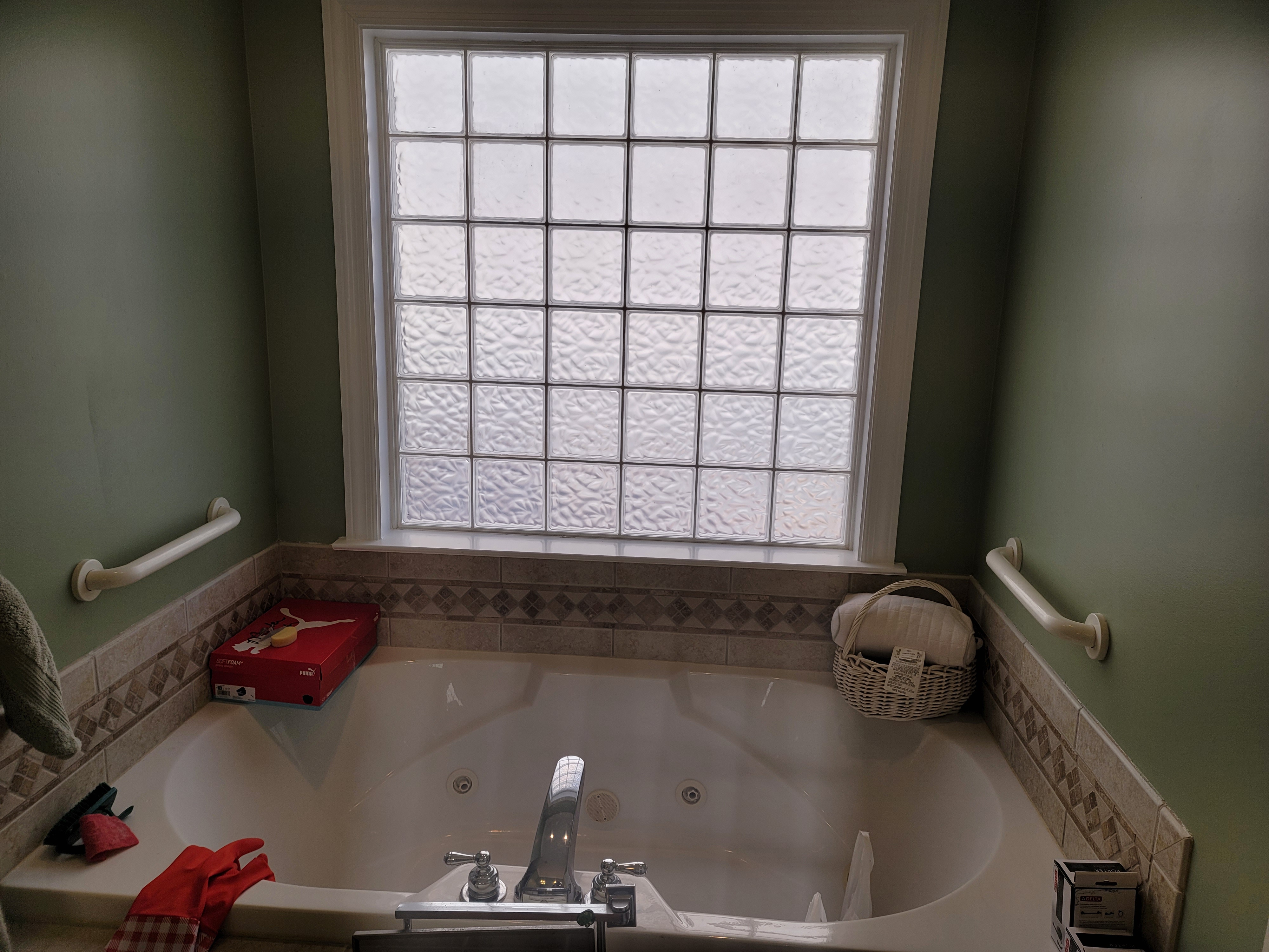Bathroom soaking tub with glass block window