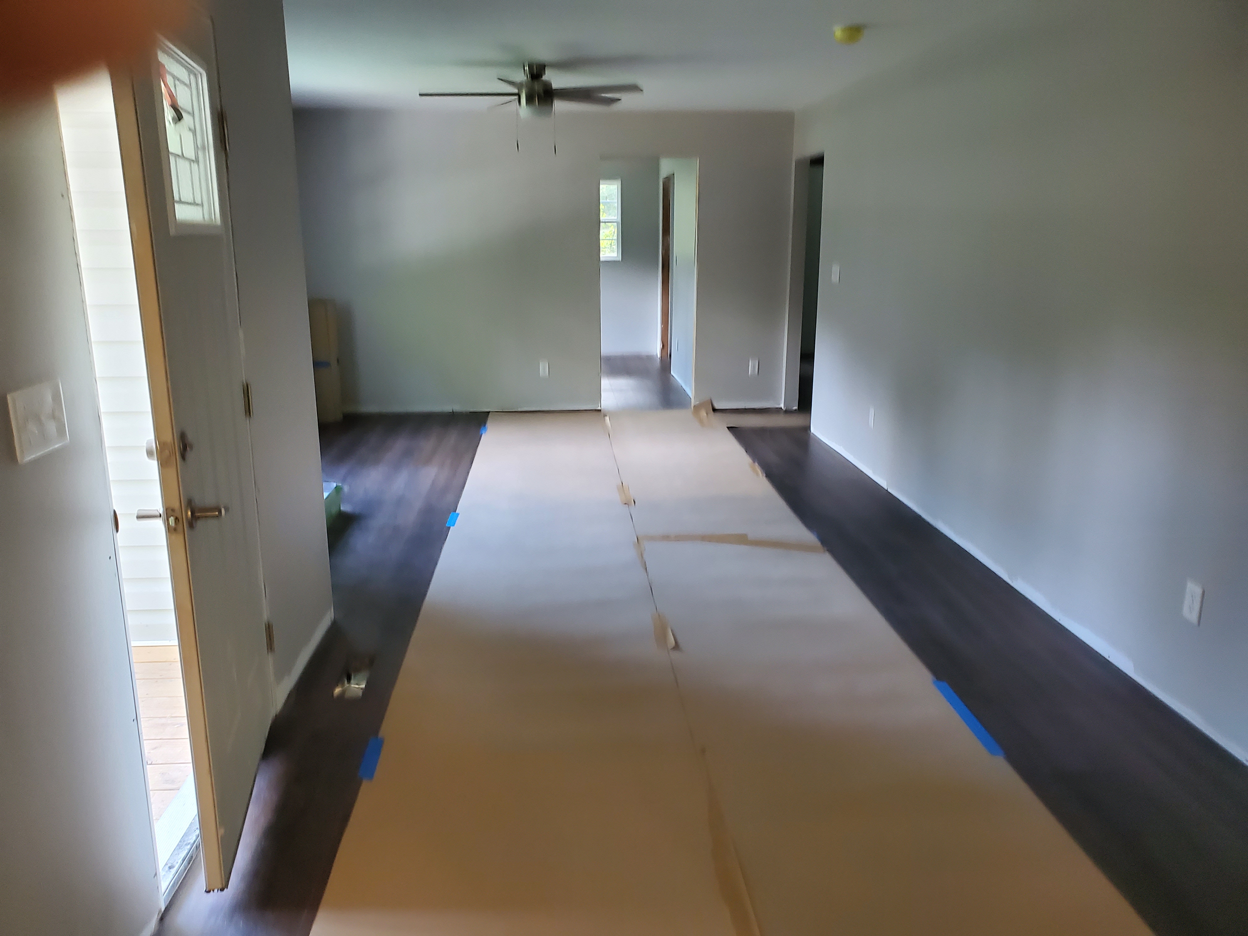 Entryway hallway with floor protection during remodel