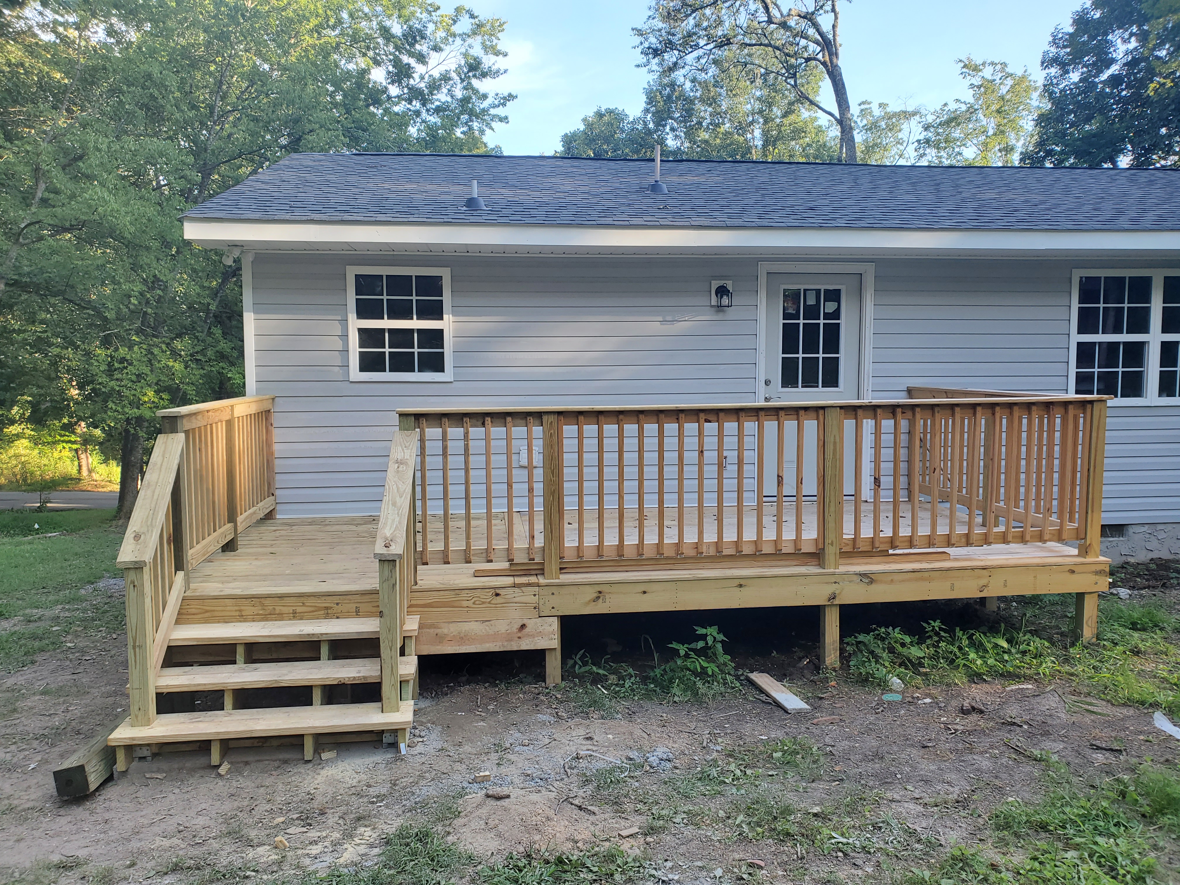 New wooden deck added to house exterior