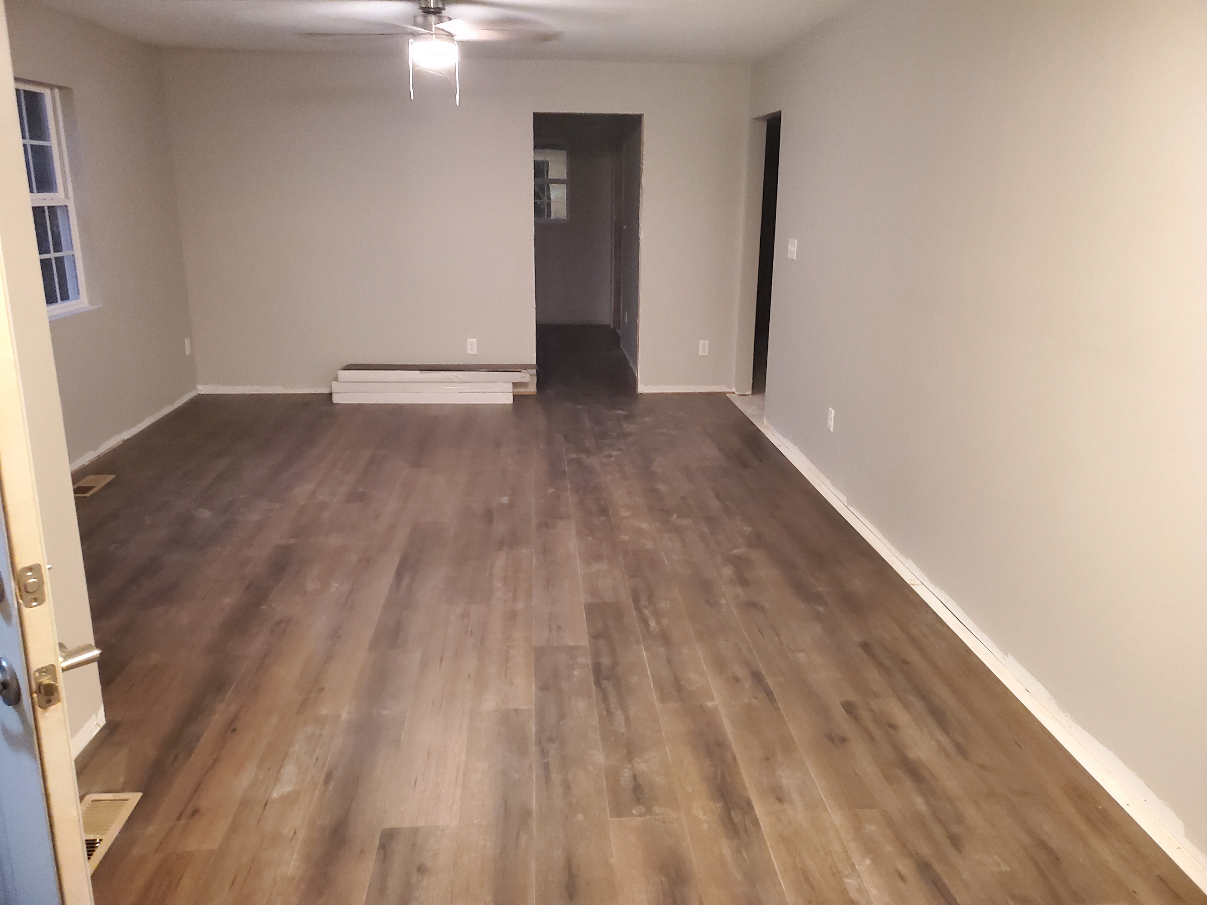Living room after – new wood laminate flooring