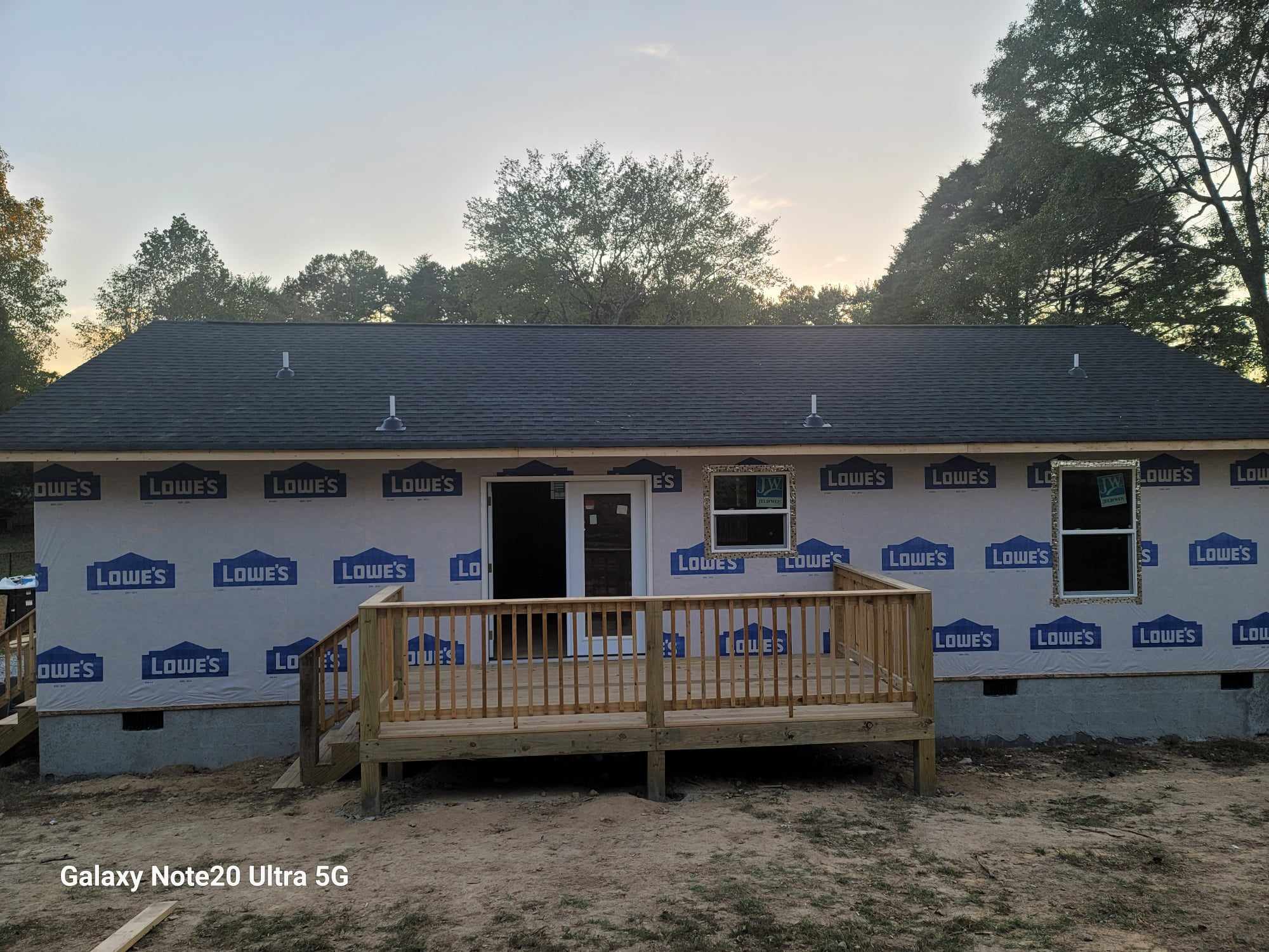 Home construction with house wrap and rear deck