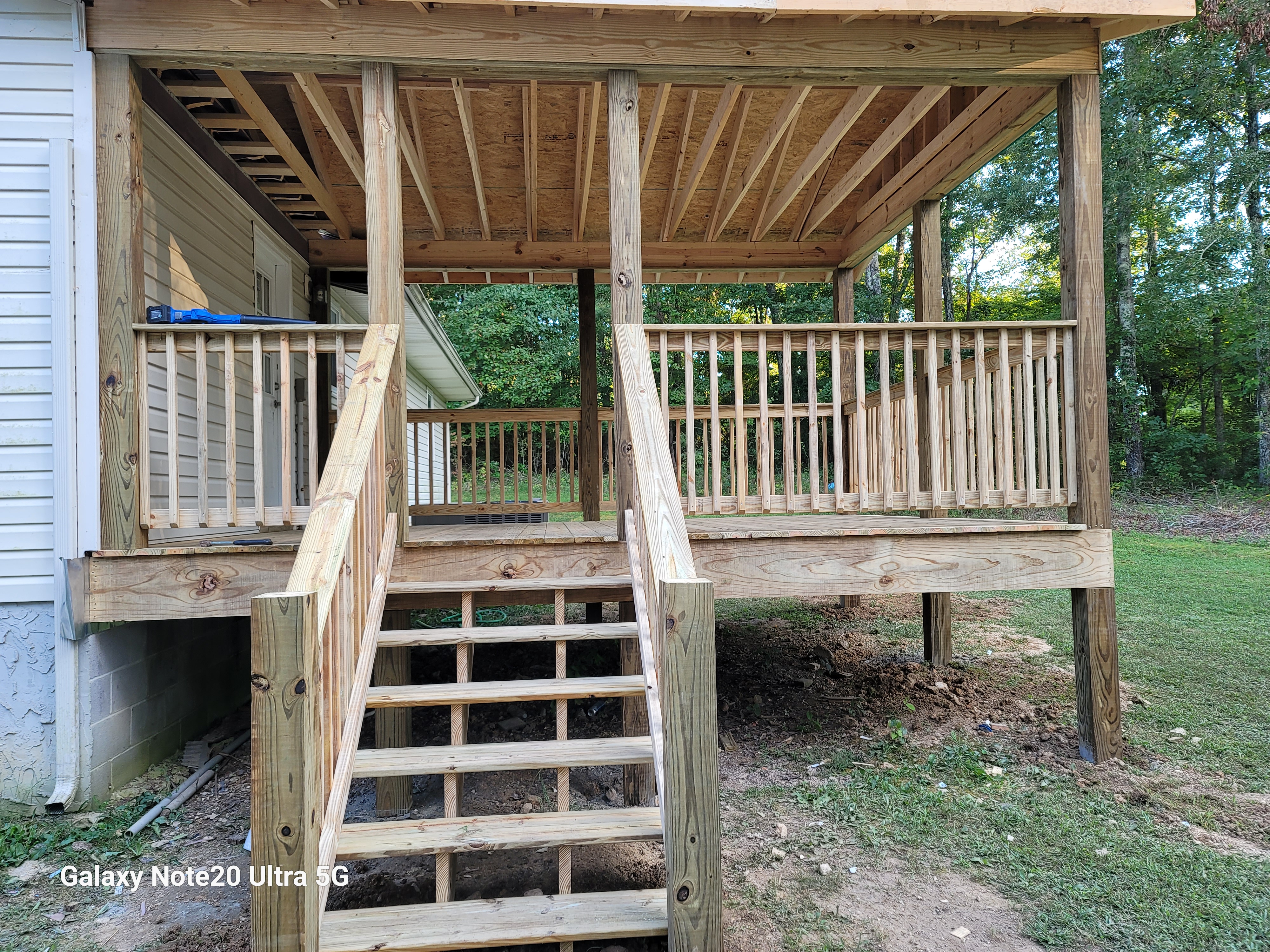 Covered deck framing with stair construction