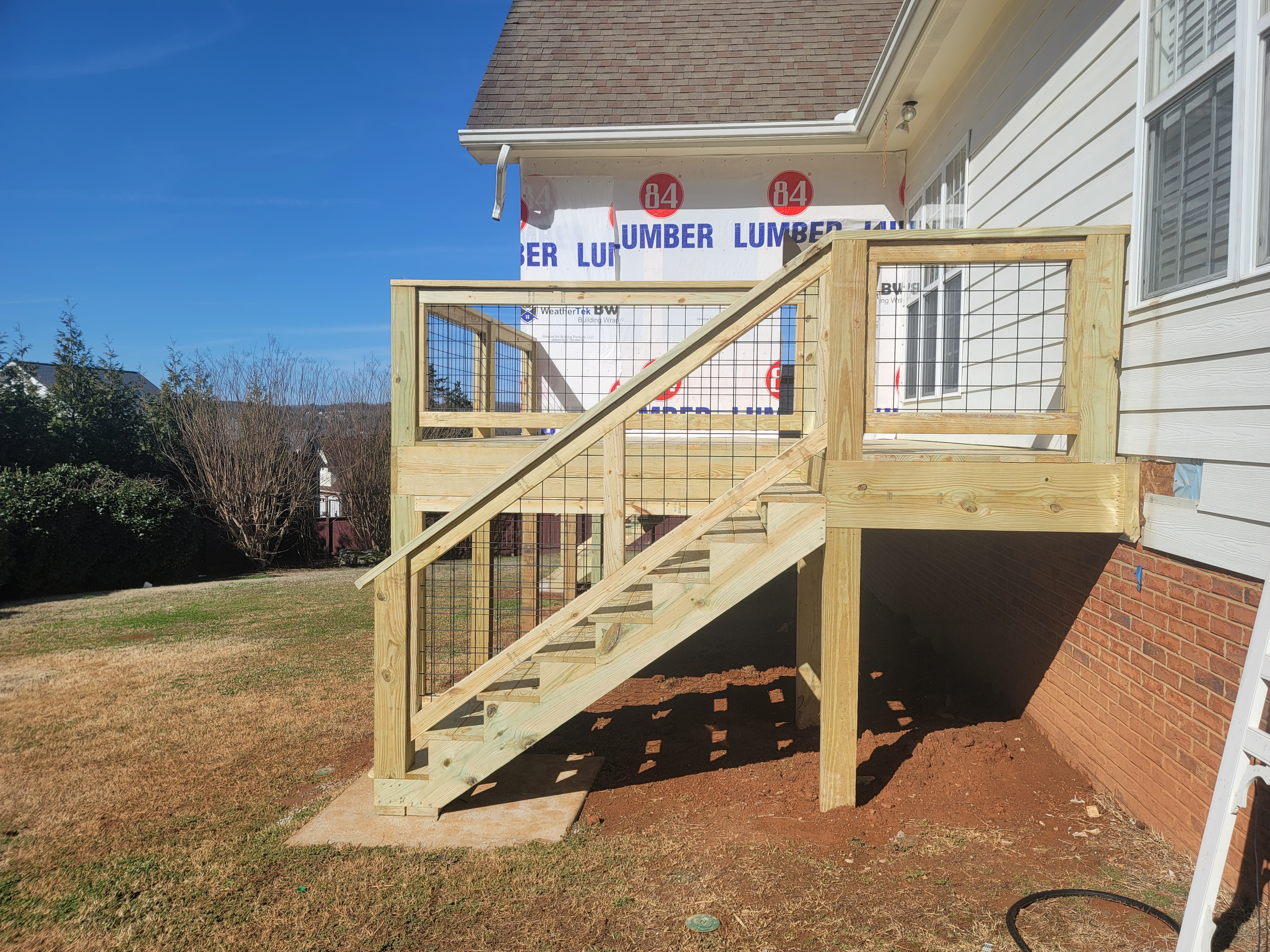 New wood deck with wire mesh railing